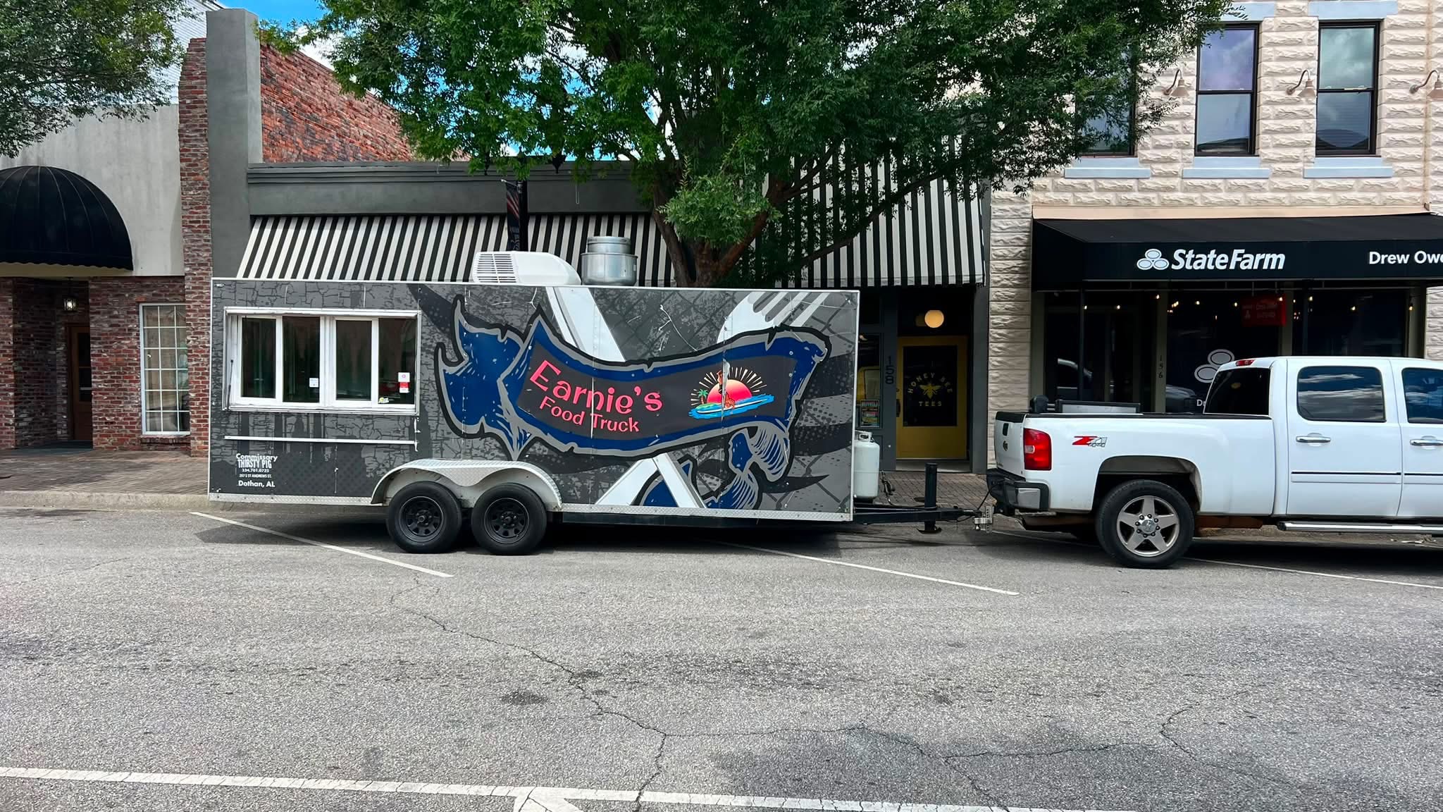 Earnie’s Food Truck trailer with its blue, silver, and coral wrap